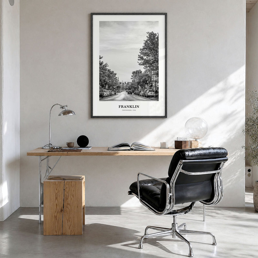 Franklin Classic Poster in a black wood frame, hanging in a bright home office