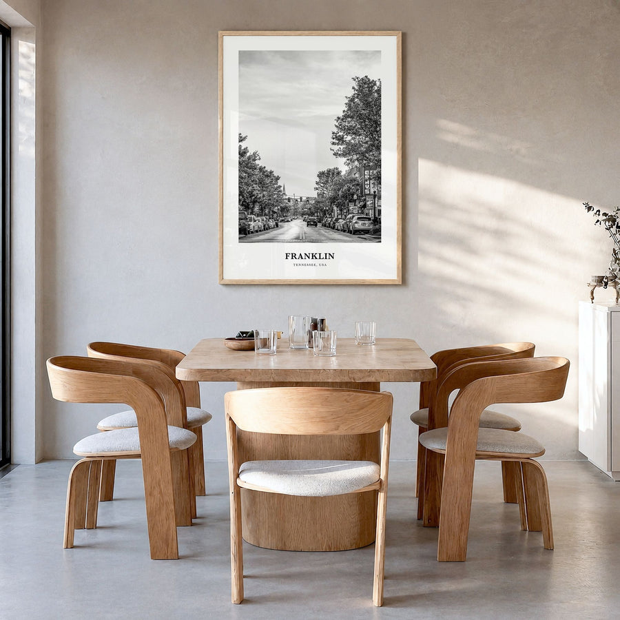 Franklin Classic Poster in a natural wood frame, hanging in a dining room