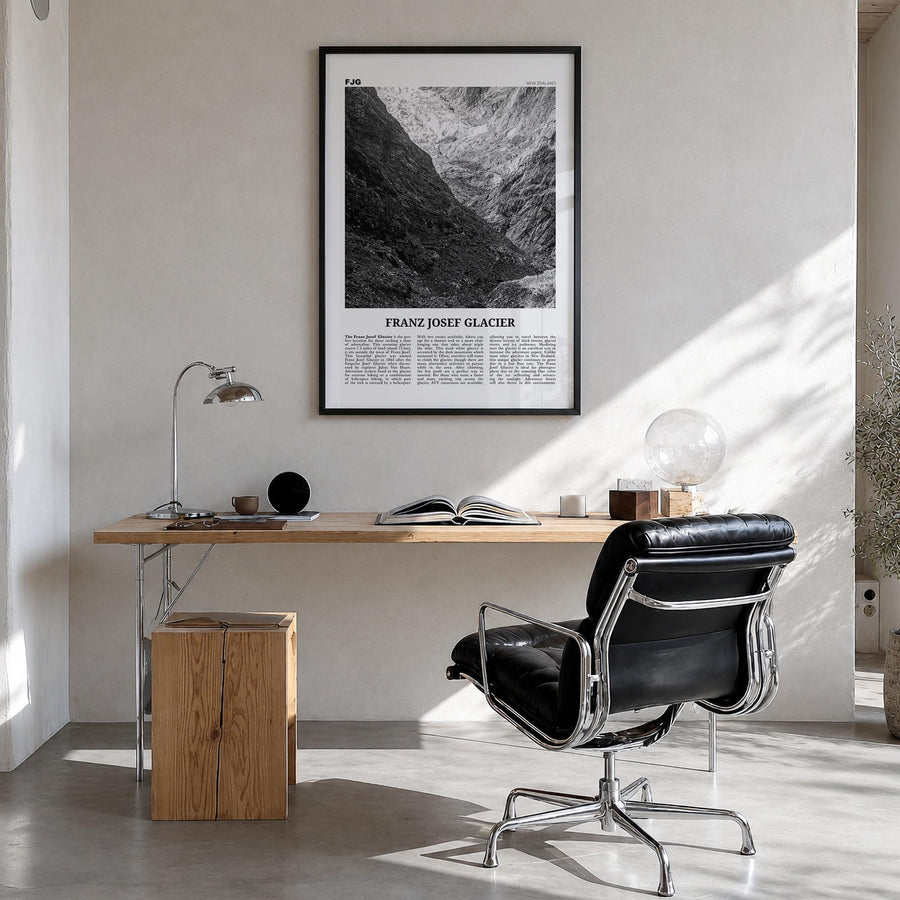 Franz Josef Glacier black & white newspaper poster of New Zealand – vertical wall art in black wood frame, hanging on wall