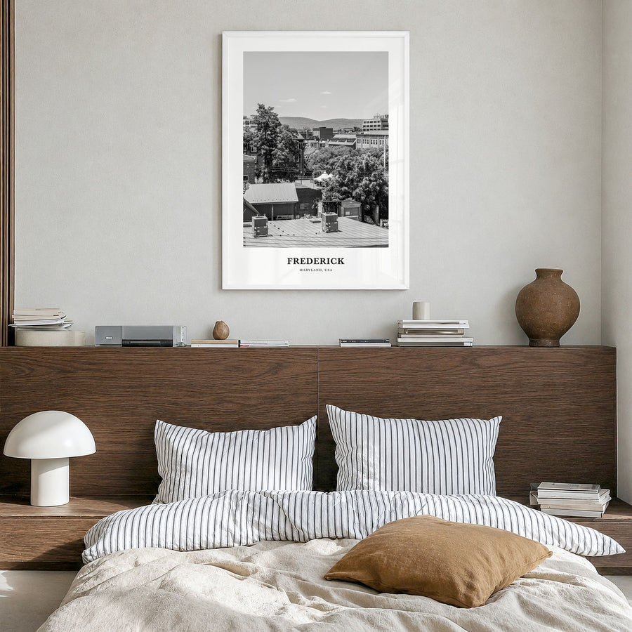 Frederick Classic Poster in a white wood frame, hanging in a bedroom