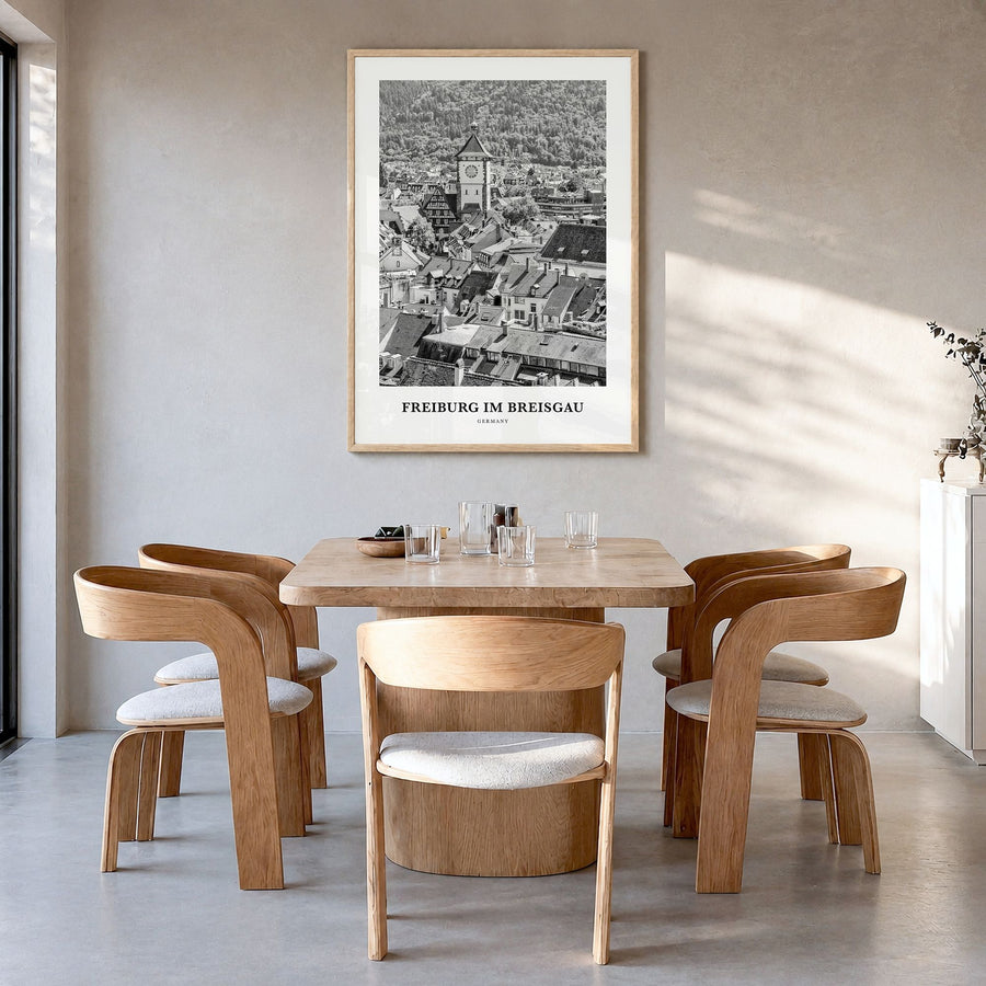 Freiburg im Breisgau Classic Poster in a natural wood frame, hanging in a dining room