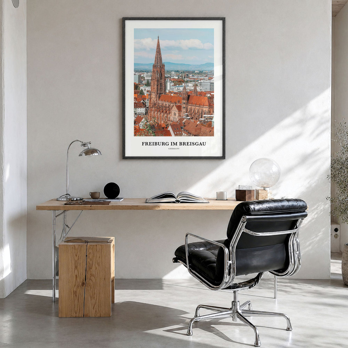 Freiburg im Breisgau Classic No 1 Poster in a black wood frame, hanging in a bright home office