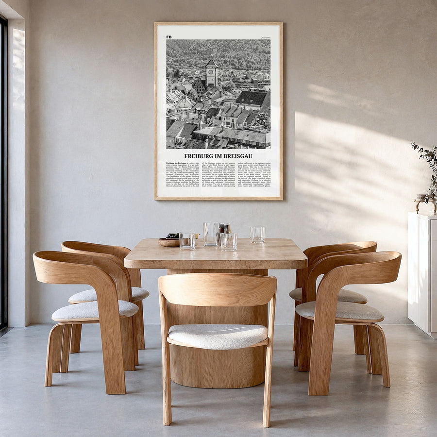 Freiburg im Breisgau Newspaper Poster in a natural wood frame, hanging in a dining room