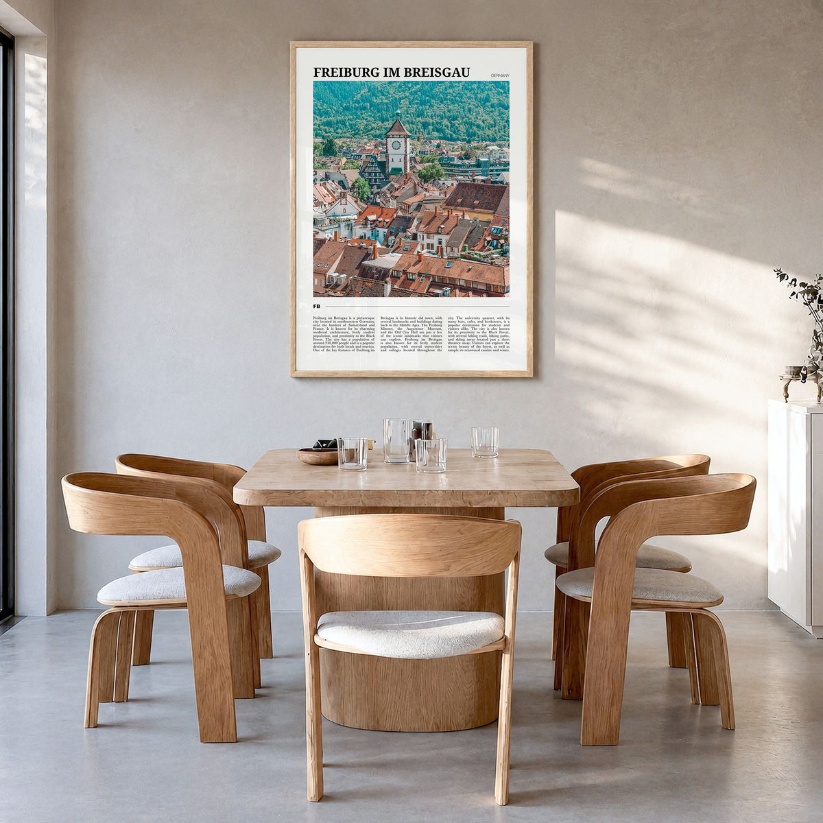 Freiburg im Breisgau Travel No 2 Poster in a natural wood frame, hanging in a dining room