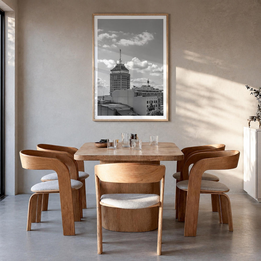 Fresno black & white photo poster of California, USA – vertical wall art in natural wood frame with white border, hanging on 