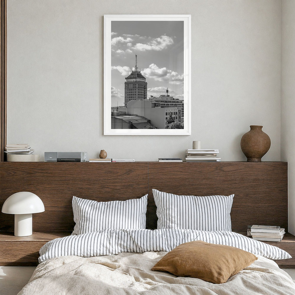 Fresno Photo Poster in a white wood frame, hanging in a bedroom, white border