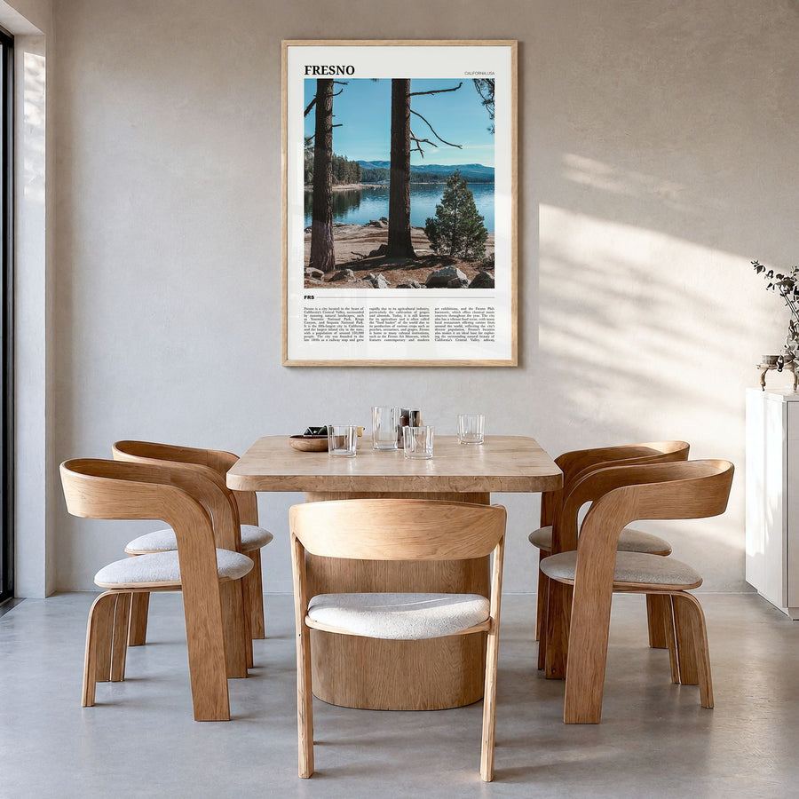Fresno Travel Poster in a natural wood frame, hanging in a dining room
