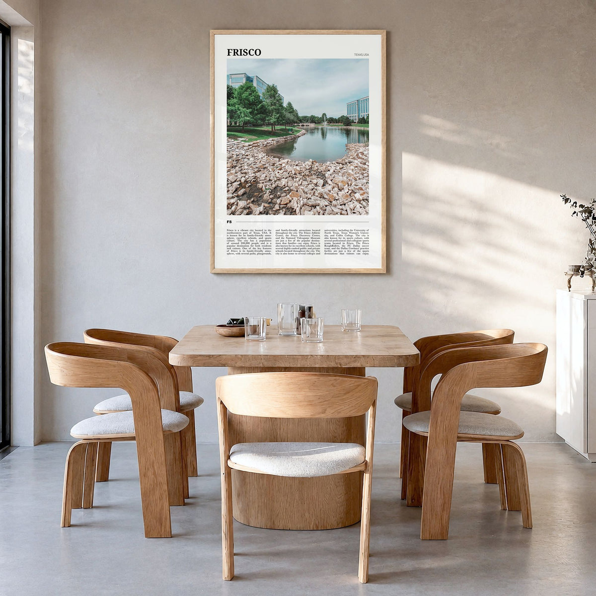 Frisco Travel Poster in a natural wood frame, hanging in a dining room