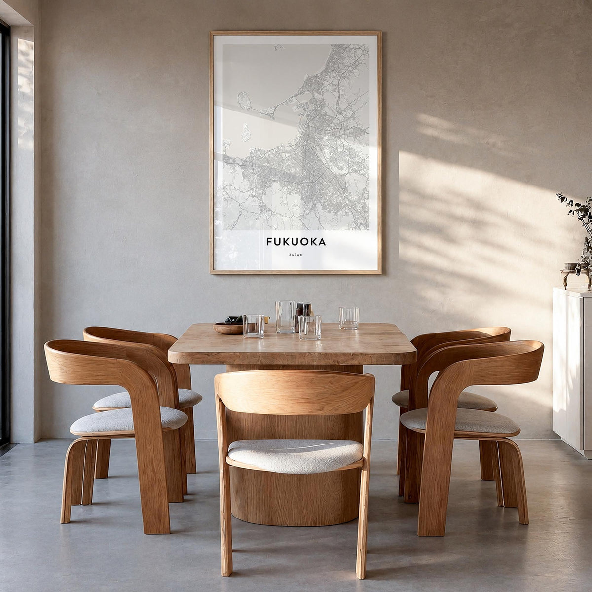 Fukuoka black & white map poster of Japan – vertical wall art in natural wood frame, hanging on wall