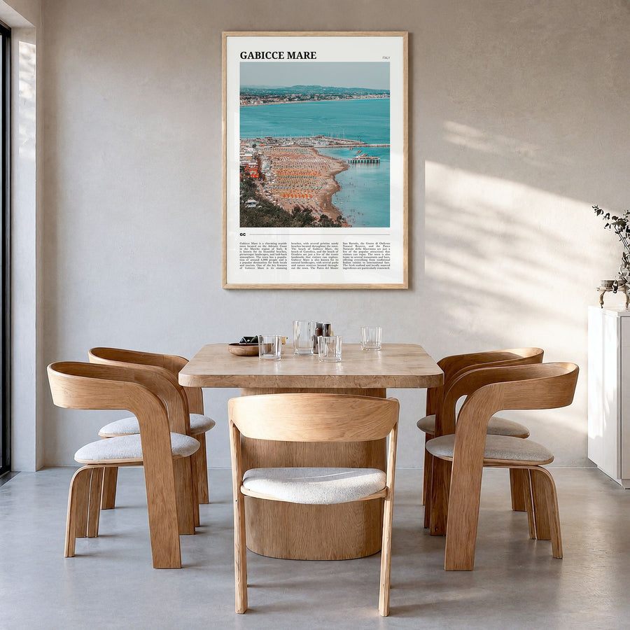 Gabicce Mare Travel Poster in a natural wood frame, hanging in a dining room