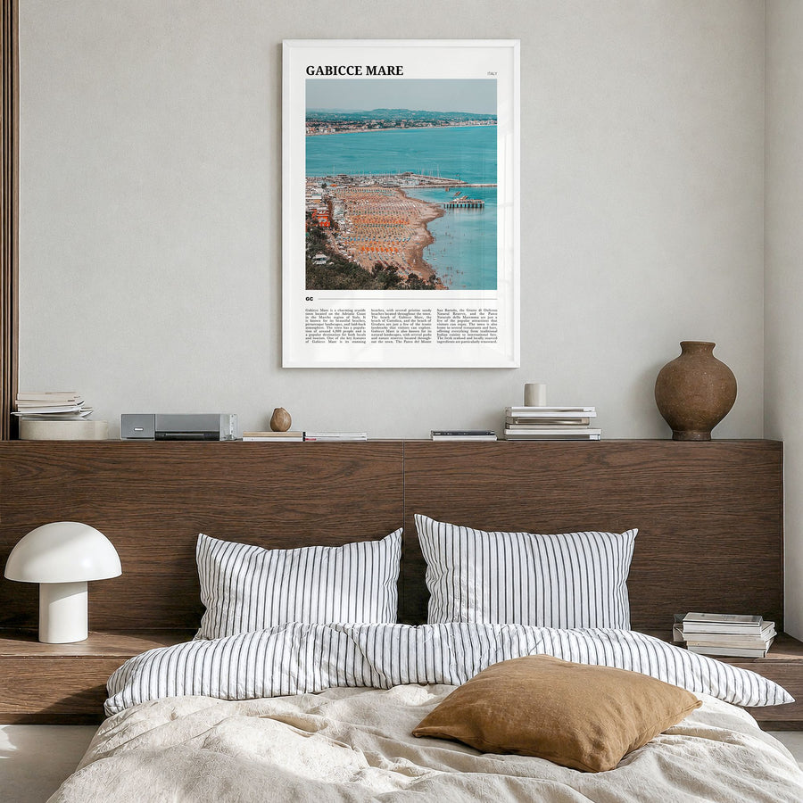 Gabicce Mare Travel Poster in a white wood frame, hanging in a bedroom