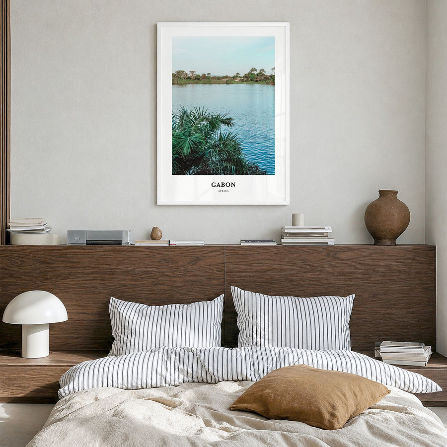 Gabon Classic Poster in a white wood frame, hanging in a bedroom
