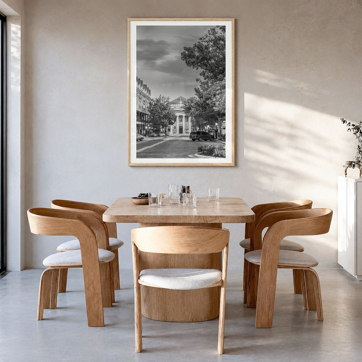 Gainesville Photo Poster in a natural wood frame, hanging in a dining room, white border