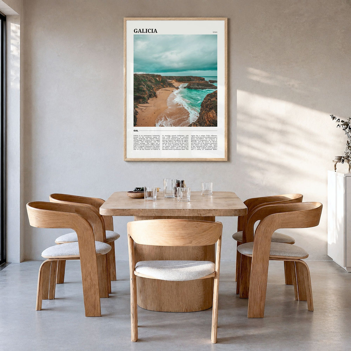 Galicia Travel Poster in a natural wood frame, hanging in a dining room