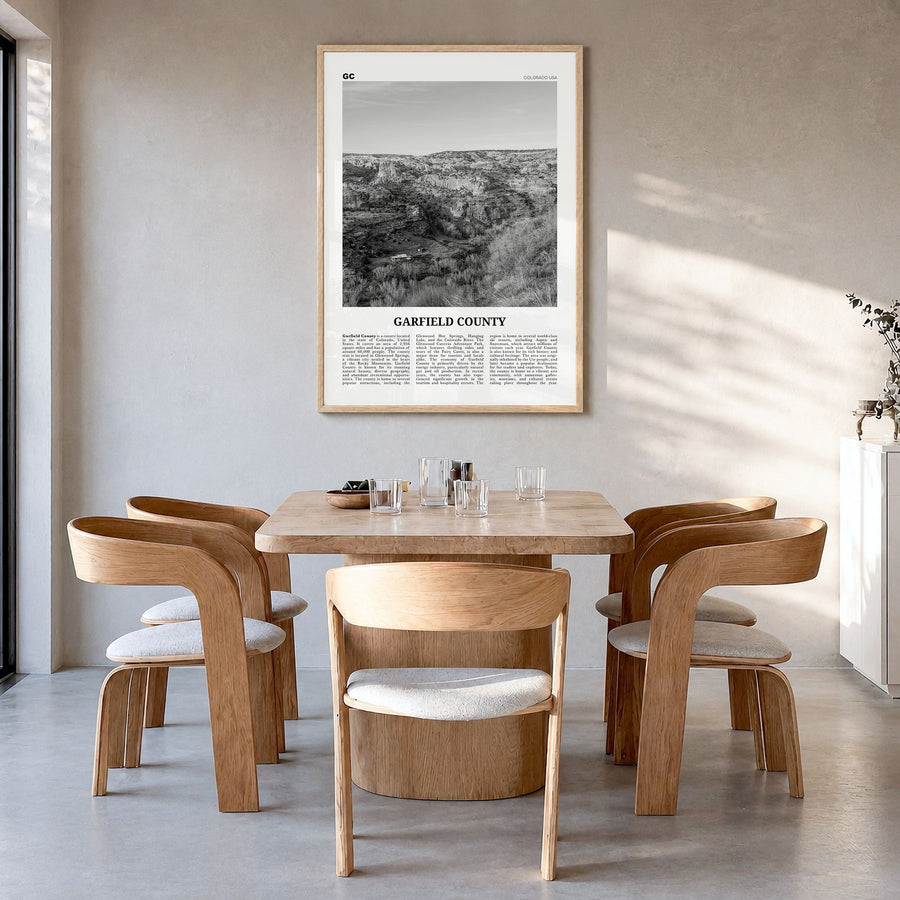 Garfield County Newspaper Poster in a natural wood frame, hanging in a dining room