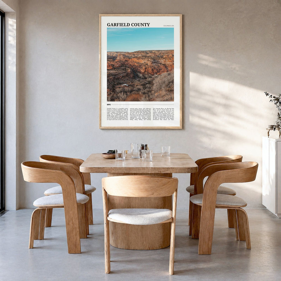 Garfield County Travel Poster in a natural wood frame, hanging in a dining room