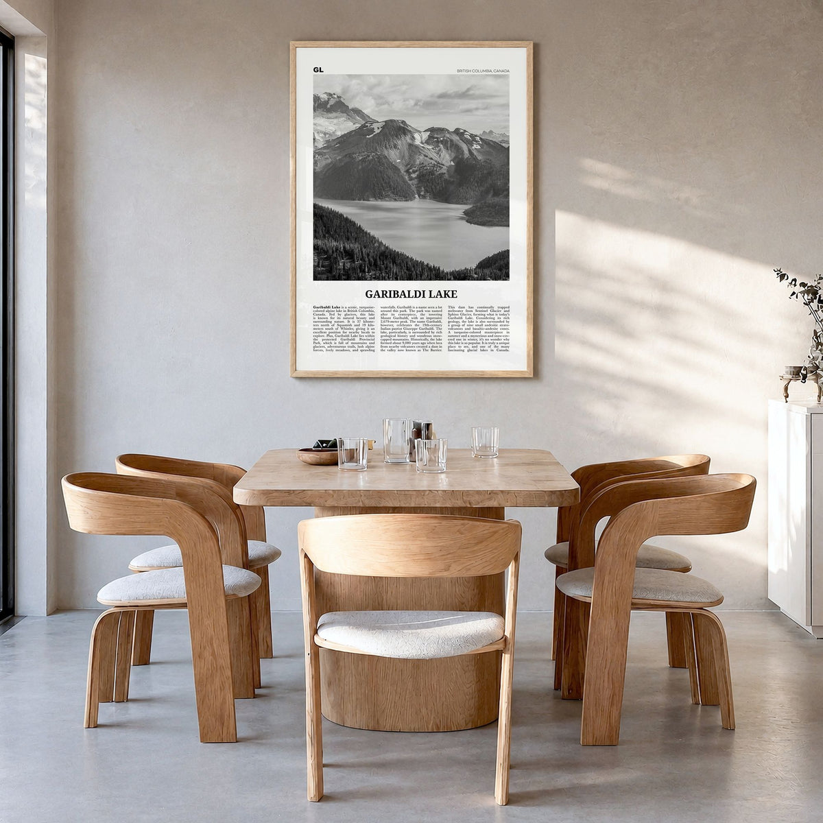 Garibaldi Lake Newspaper Poster in a natural wood frame, hanging in a dining room