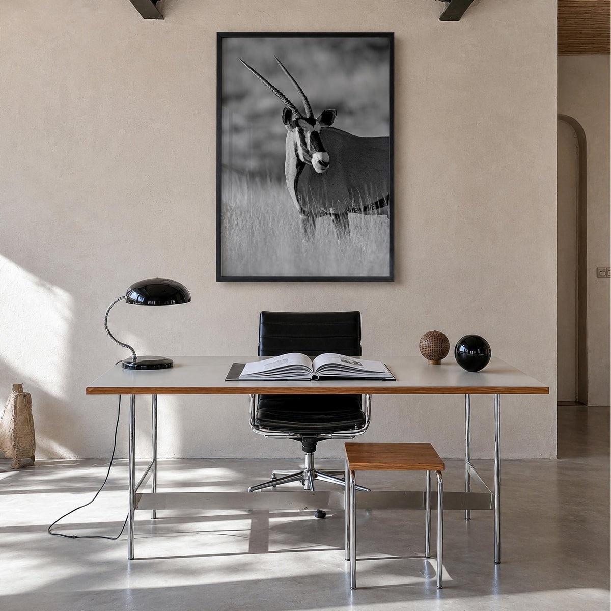 Gazella black & white photo poster – vertical wall art in black wood frame, hanging on wall