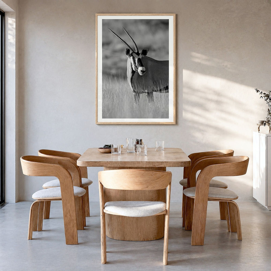 Gazelle Photo Poster in a natural wood frame, hanging in a dining room, white border