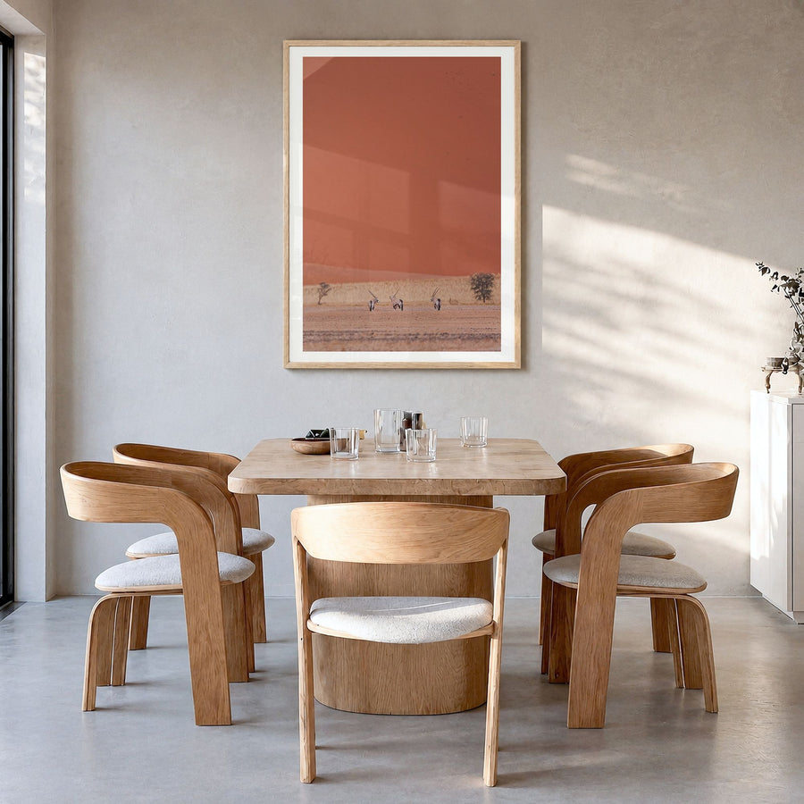 Gazelle Photo Poster in a natural wood frame, hanging in a dining room, white border