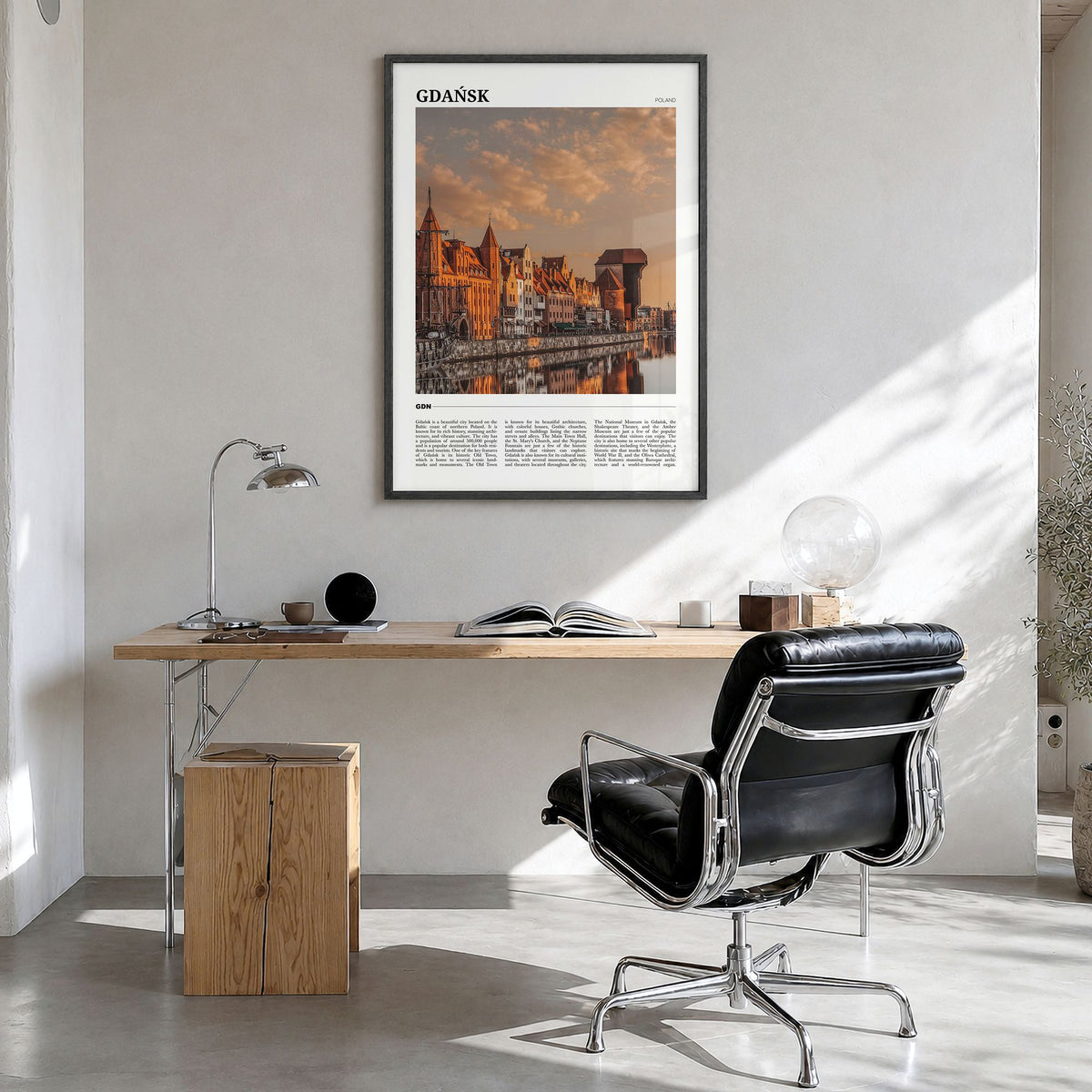 Gdańsk Travel Poster in a black wood frame, hanging in a bright home office
