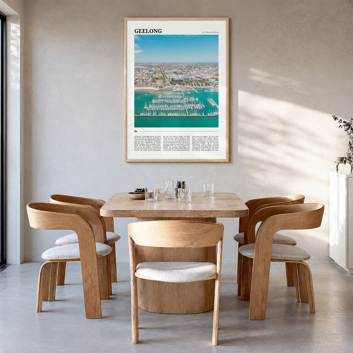Geelong Travel Poster in a natural wood frame, hanging in a dining room
