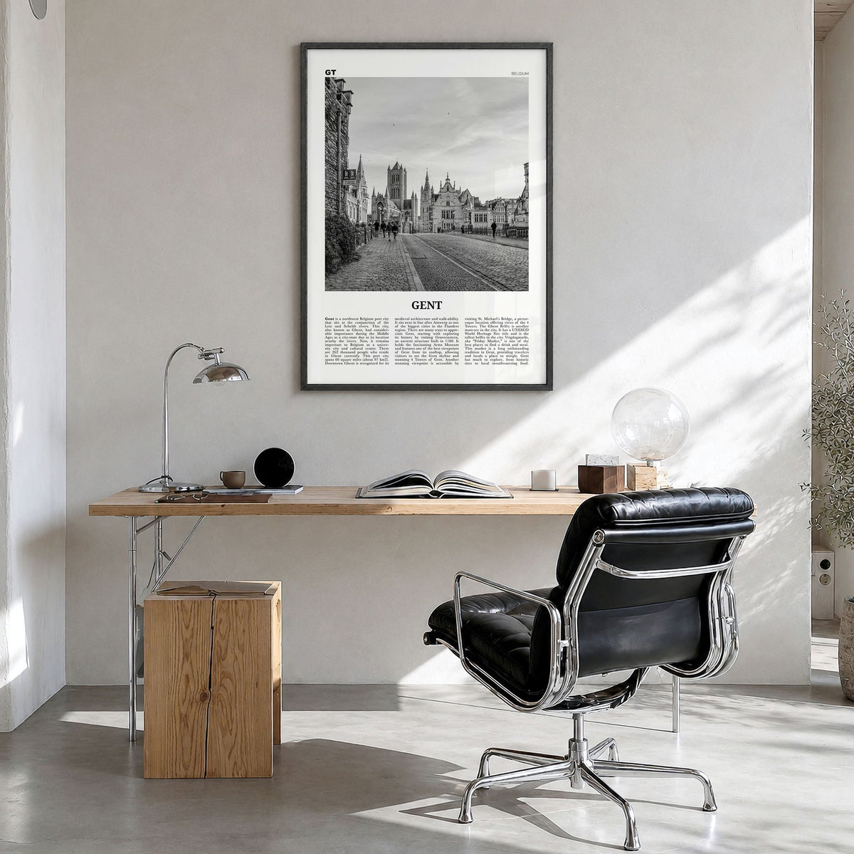 Gent Newspaper Poster in a black wood frame, hanging in a bright home office