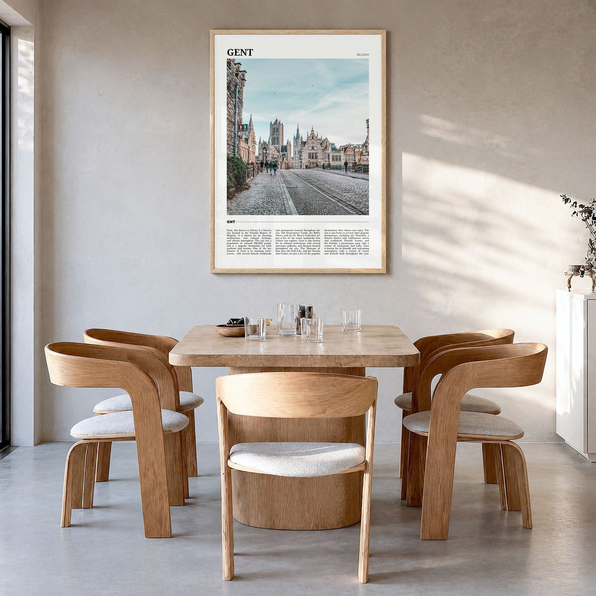 Gent Travel Poster in a natural wood frame, hanging in a dining room