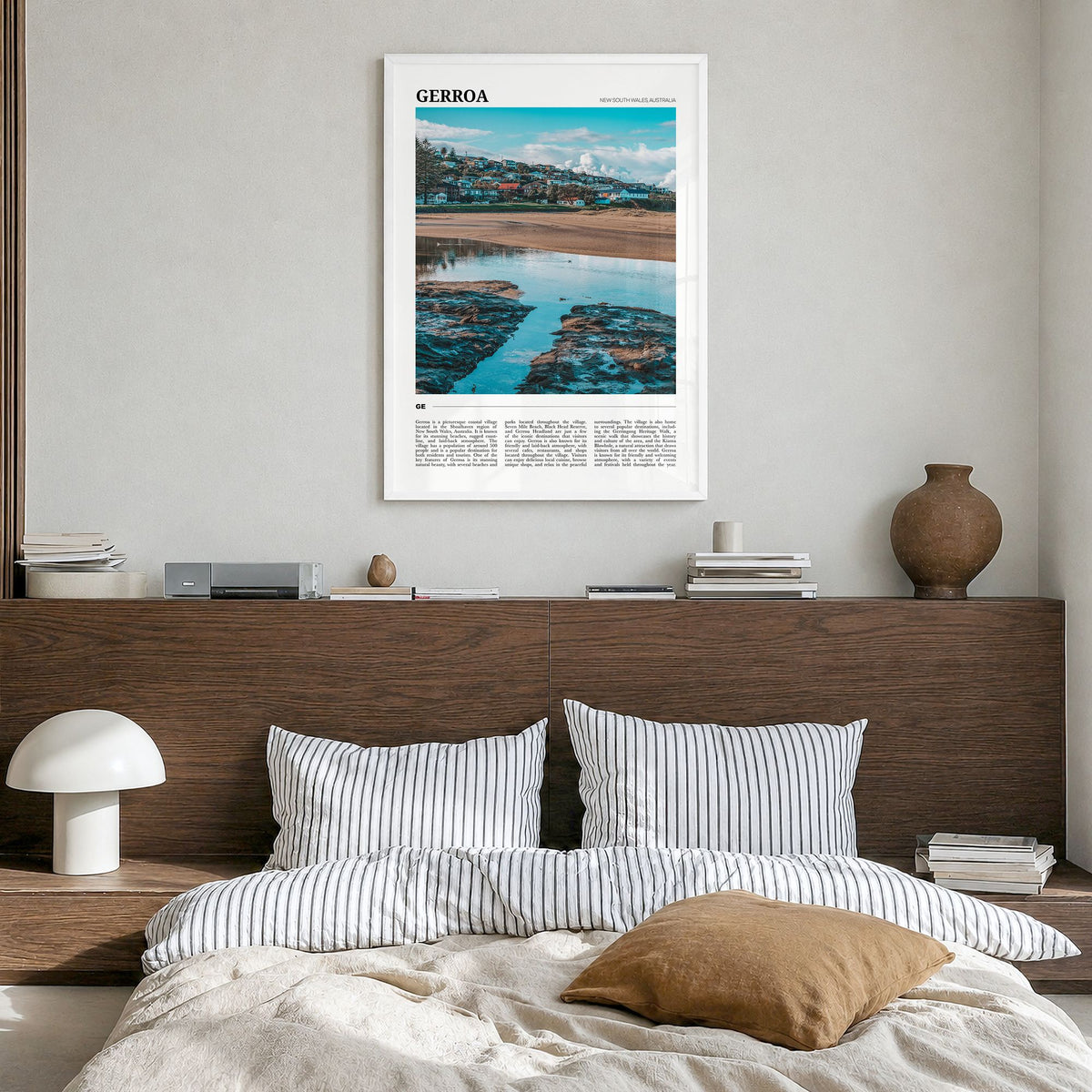 Gerroa Travel Poster in a white wood frame, hanging in a bedroom