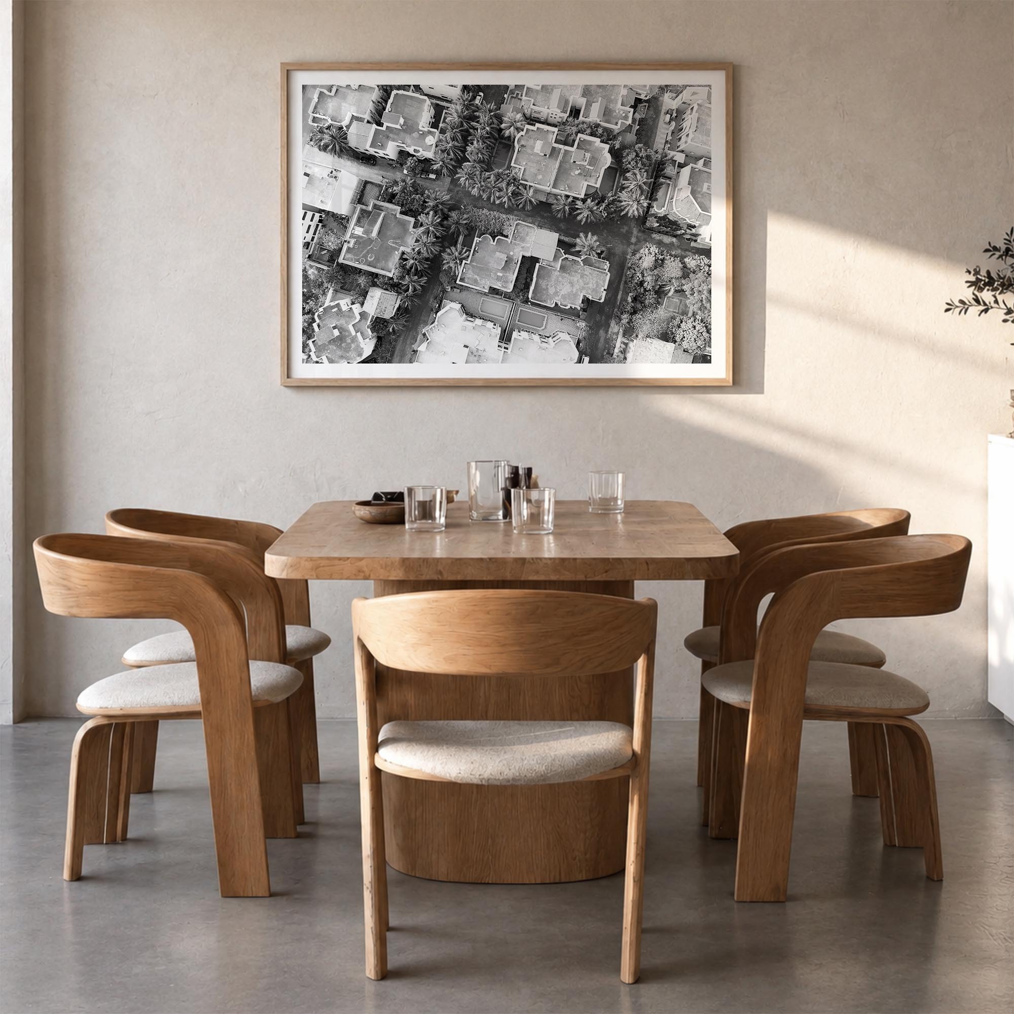 Ghana black & white photo poster of Africa – horizontal wall art in natural wood frame with white border, hanging on wall