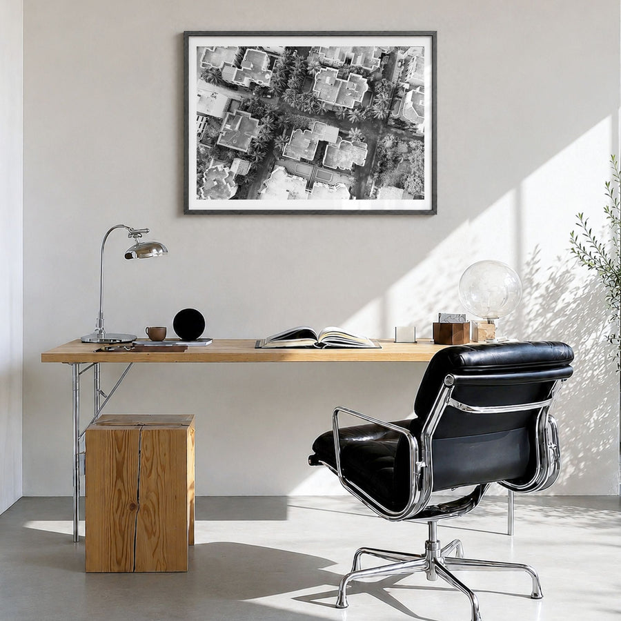 Ghana Photo Poster in a black wood frame, hanging in a bright home office, white border