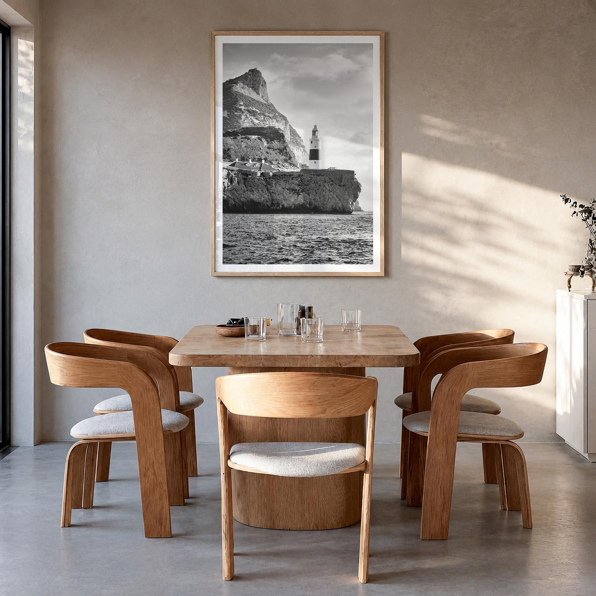 Gibraltar black & white photo poster of Europe – vertical wall art in natural wood frame with white border, hanging on wall