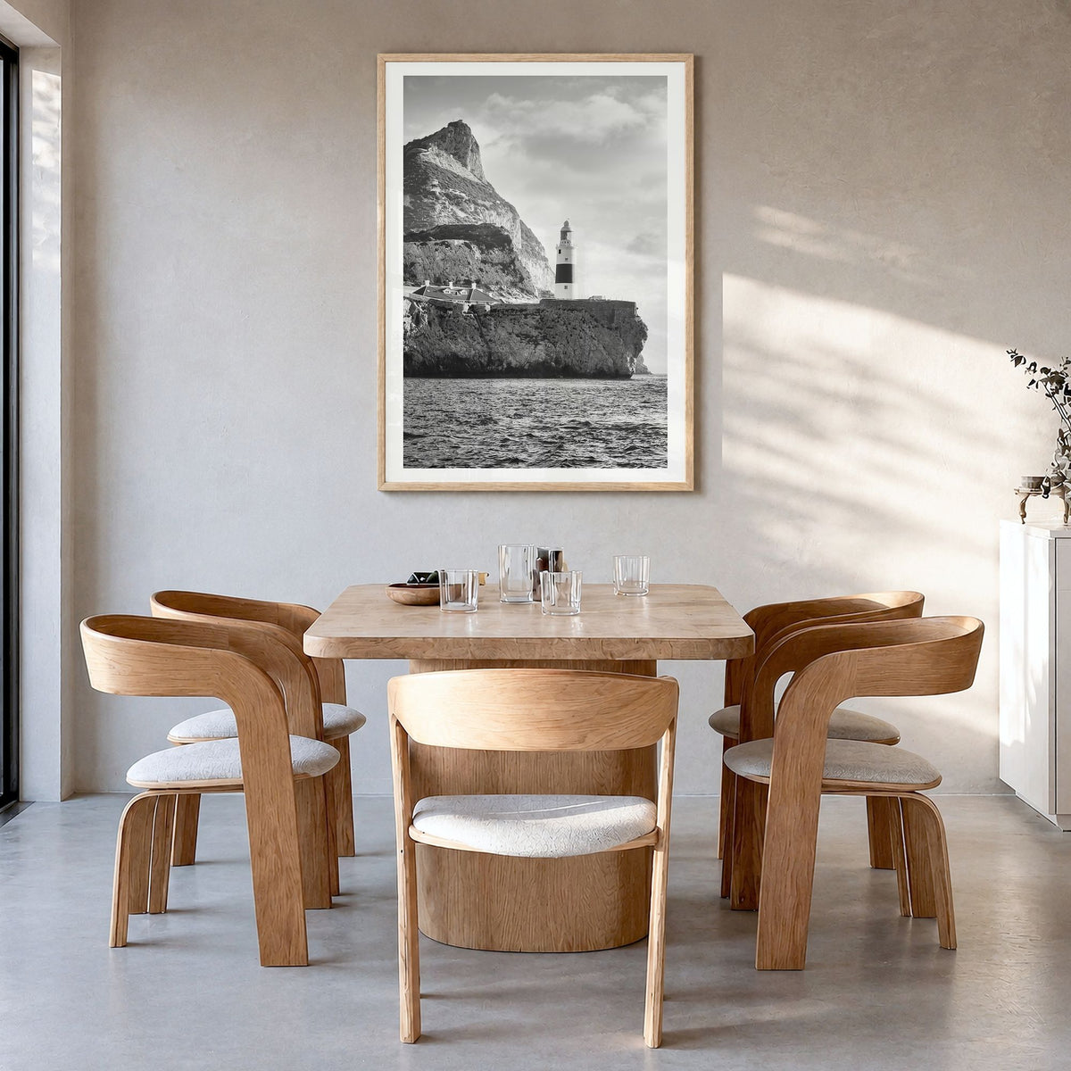 Gibraltar Photo Poster in a natural wood frame, hanging in a dining room, white border