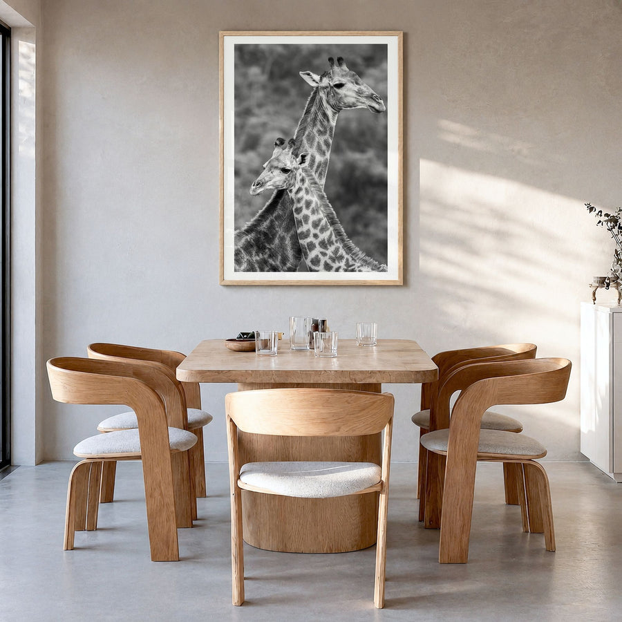 Giraffe Photo No 2 Poster in a natural wood frame, hanging in a dining room, white border