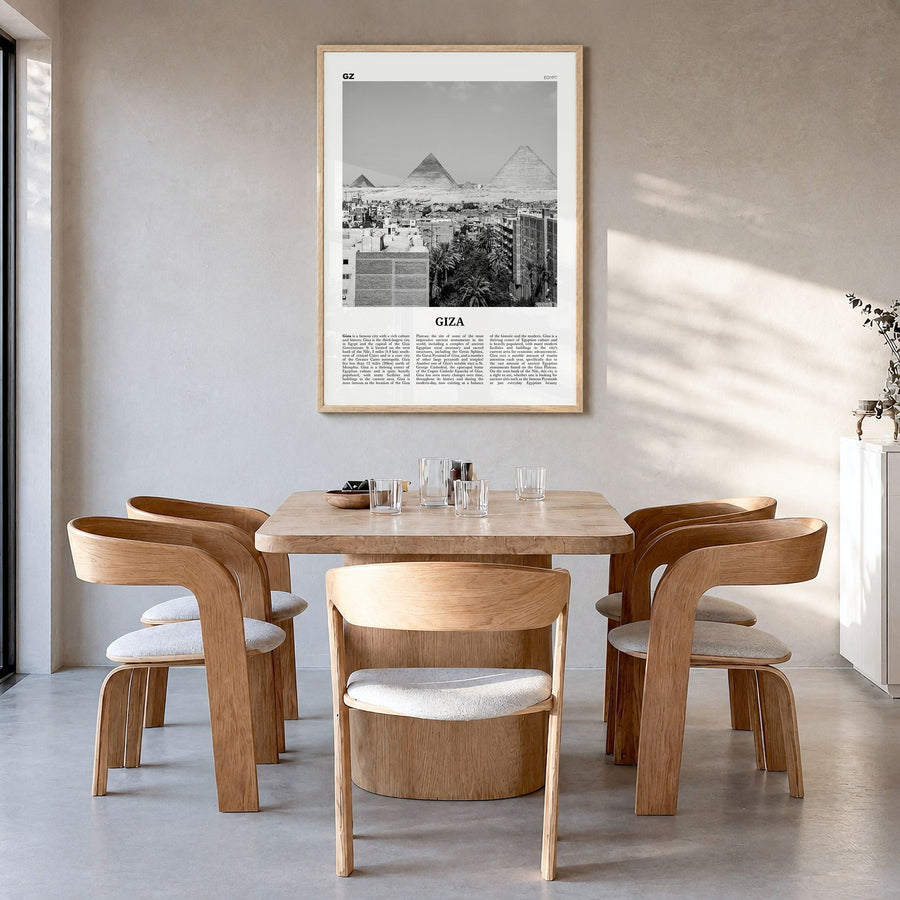 Giza Newspaper Poster in a natural wood frame, hanging in a dining room