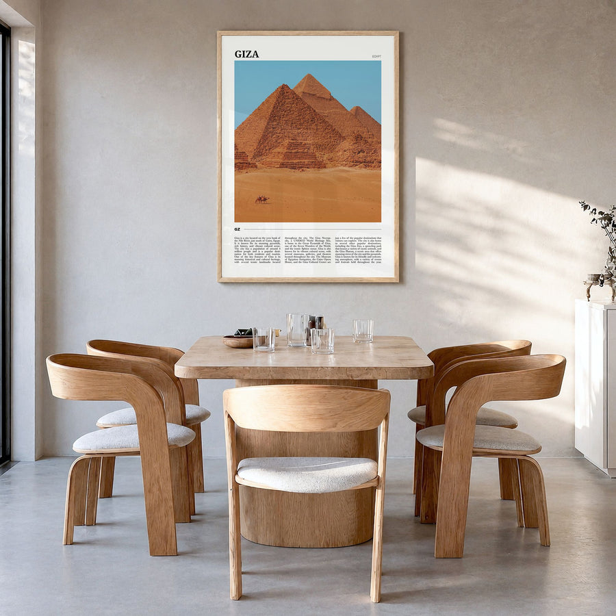 Giza Travel Poster in a natural wood frame, hanging in a dining room
