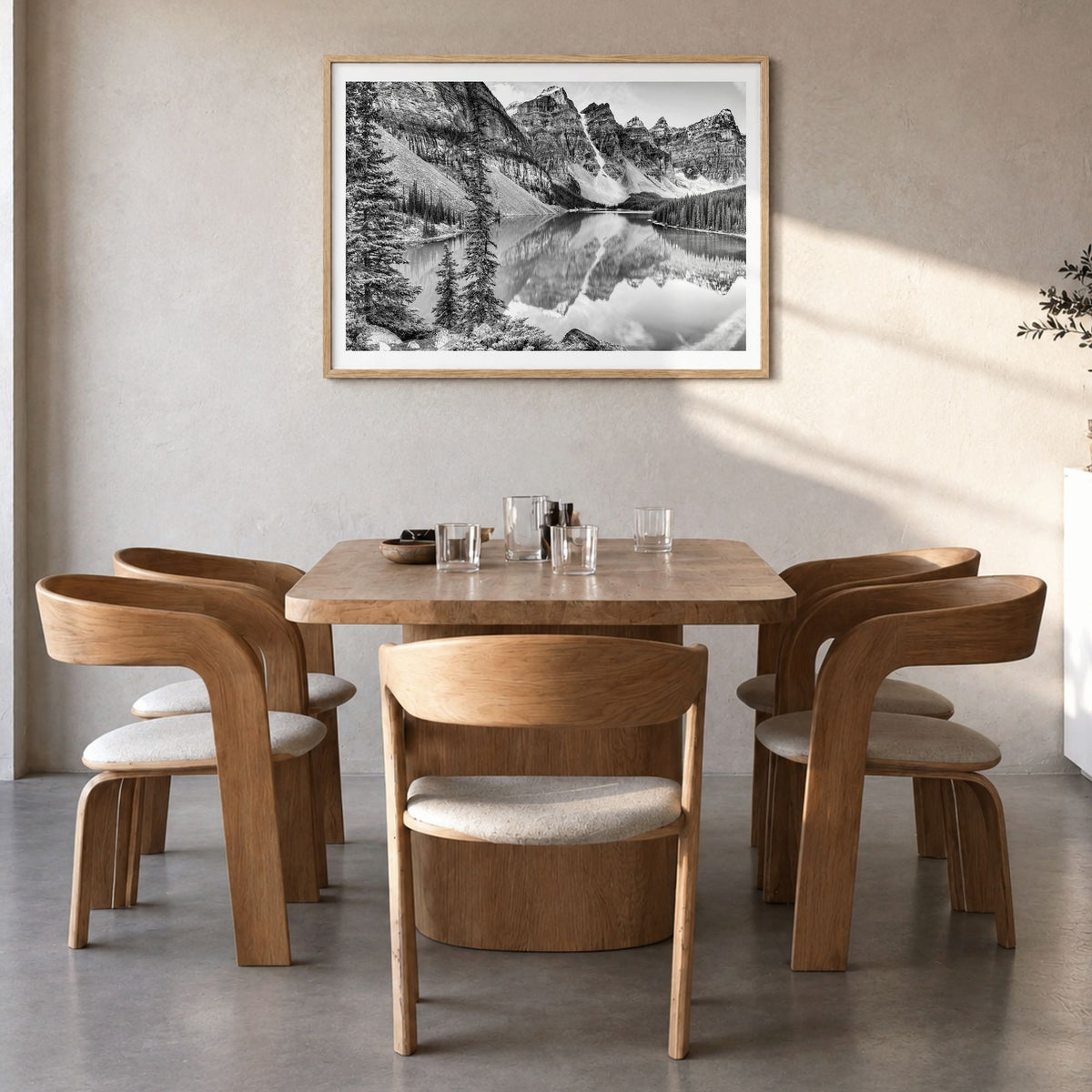 Glacier National Park Photo Poster in a natural wood frame, hanging in a dining room, white border