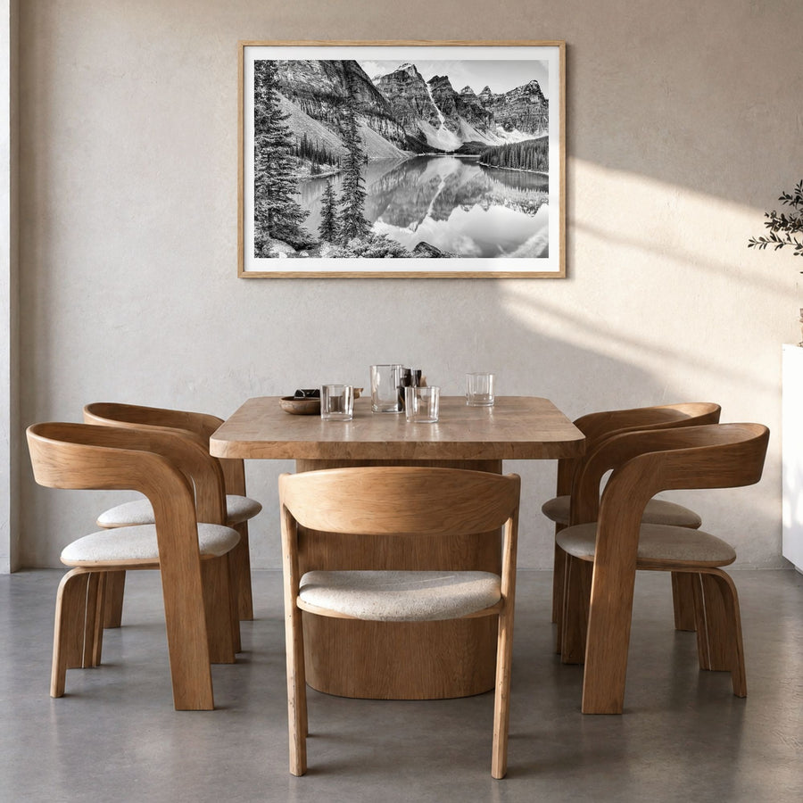 Glacier National Park Photo Poster in a natural wood frame, hanging in a dining room, white border