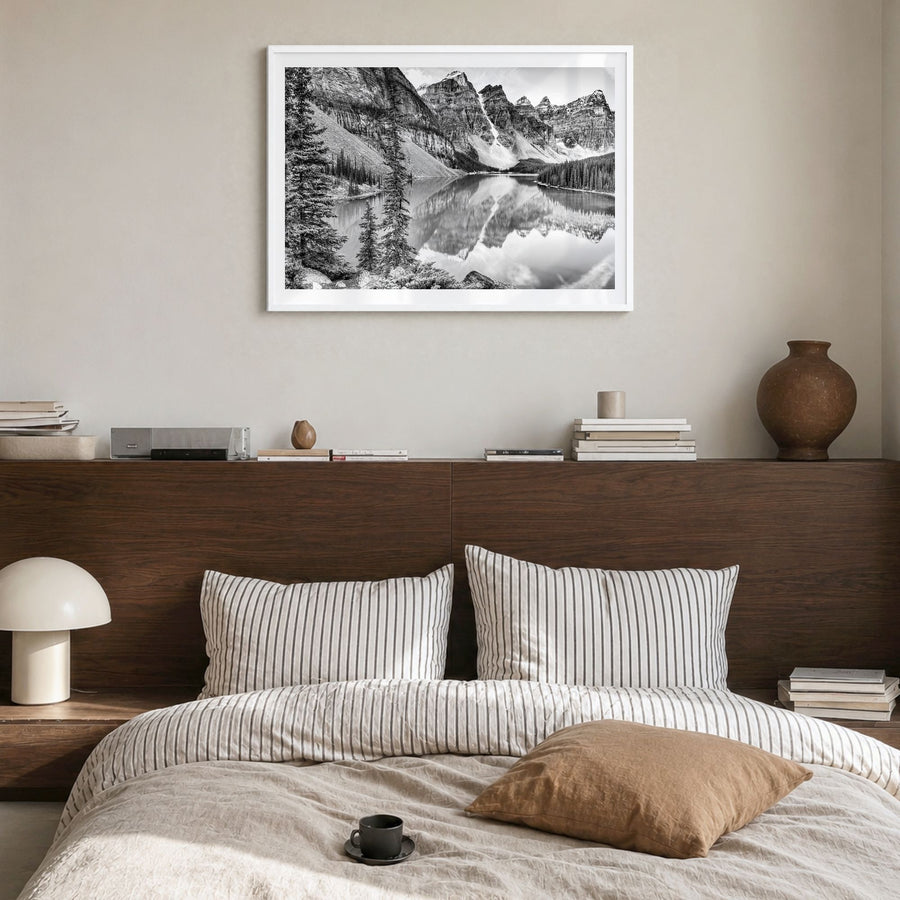 Glacier National Park Photo Poster in a white wood frame, hanging in a bedroom, white border