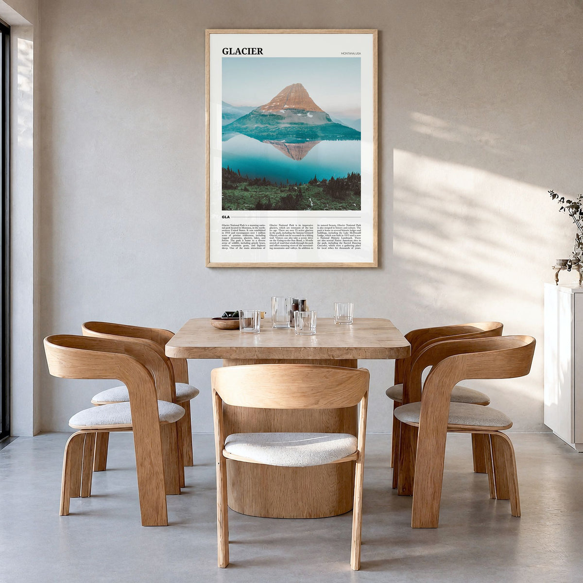 Glacier National Park Travel Poster in a natural wood frame, hanging in a dining room