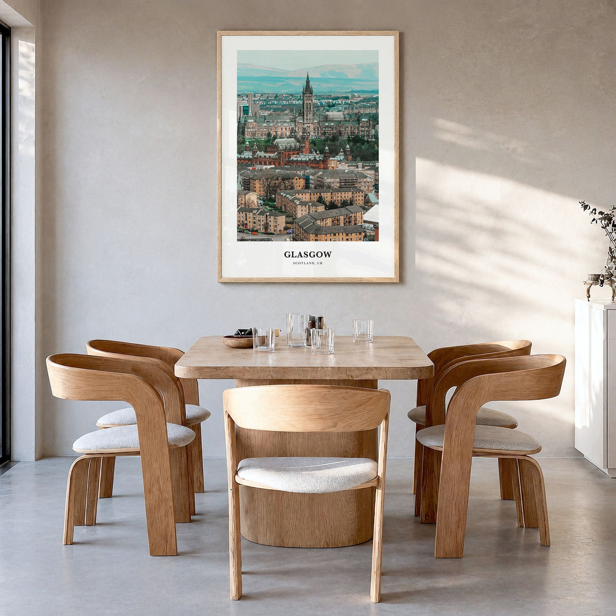 Glasgow Classic Poster in a natural wood frame, hanging in a dining room