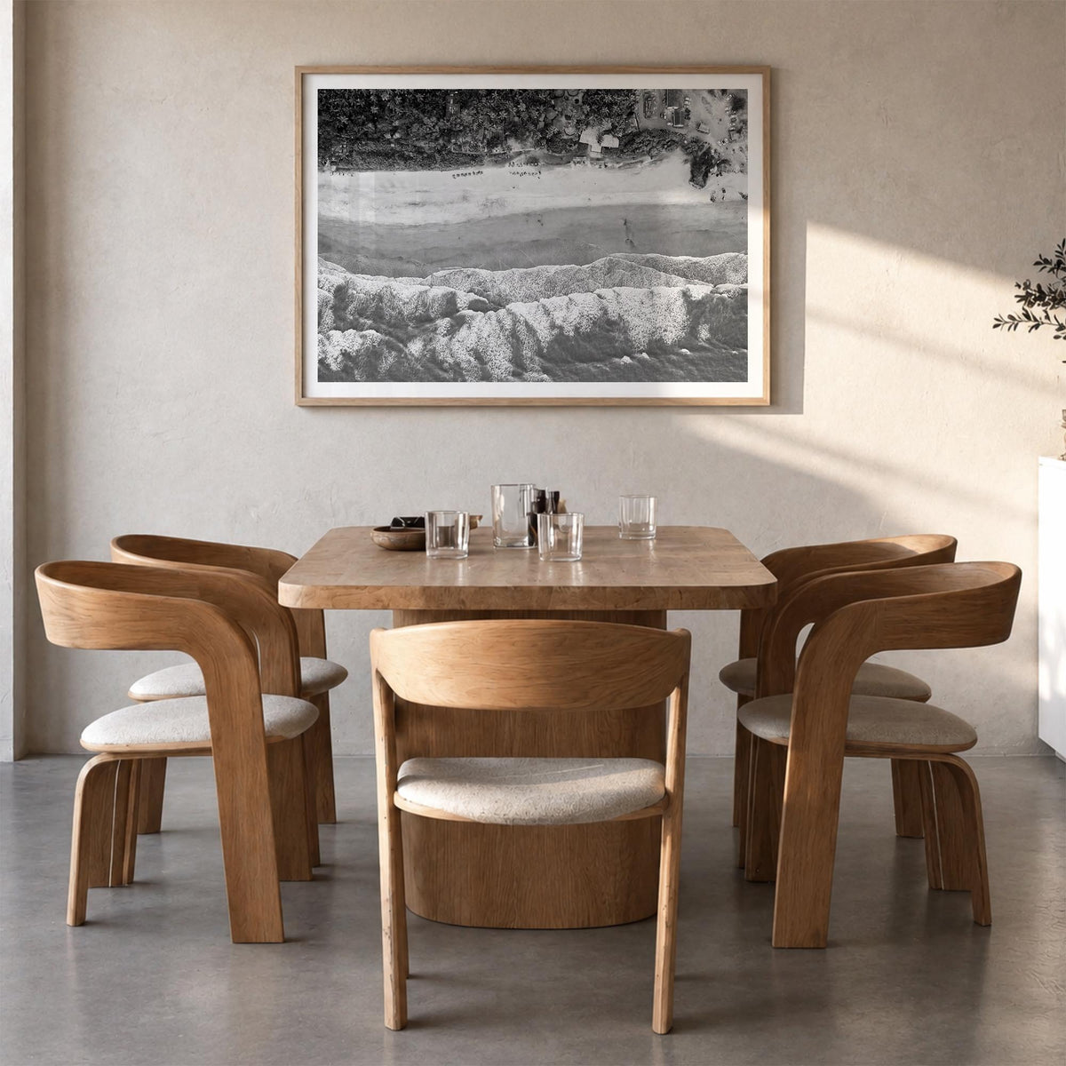 Goa black & white photo poster of India – horizontal wall art in natural wood frame with white border, hanging on wall