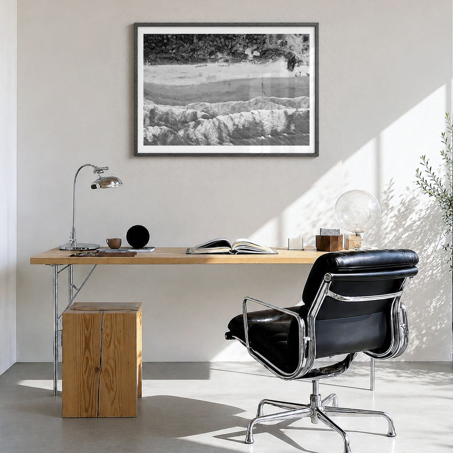 Goa Photo Poster in a black wood frame, hanging in a bright home office, white border