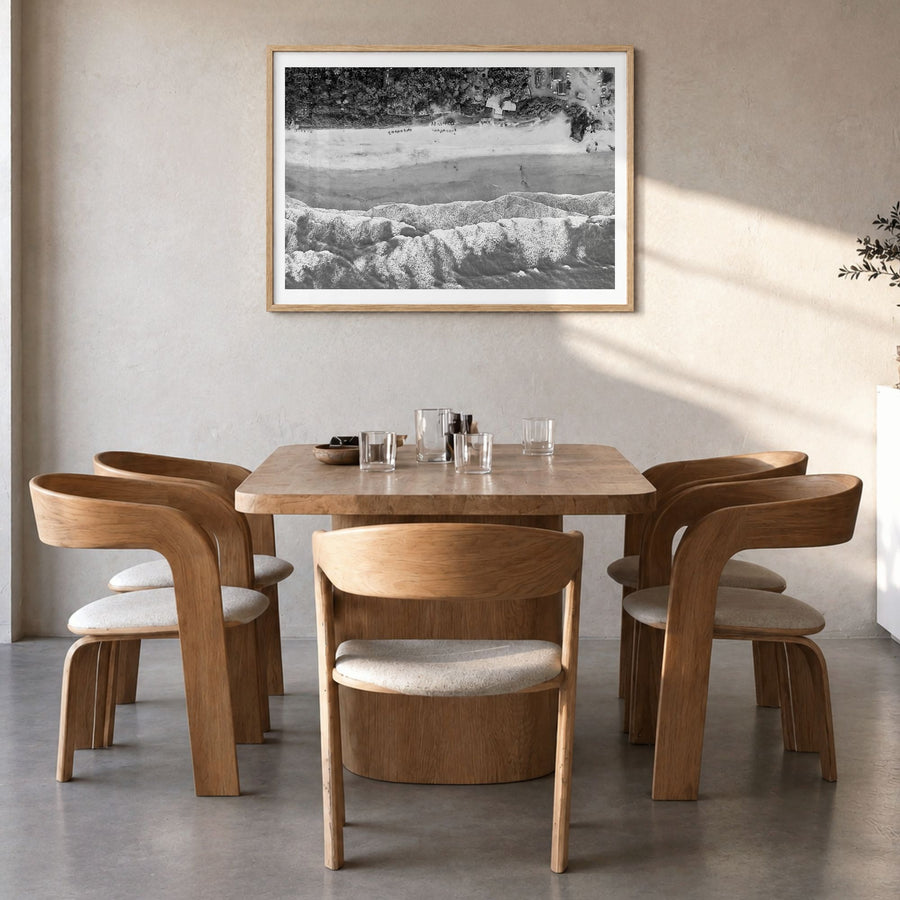 Goa Photo Poster in a natural wood frame, hanging in a dining room, white border
