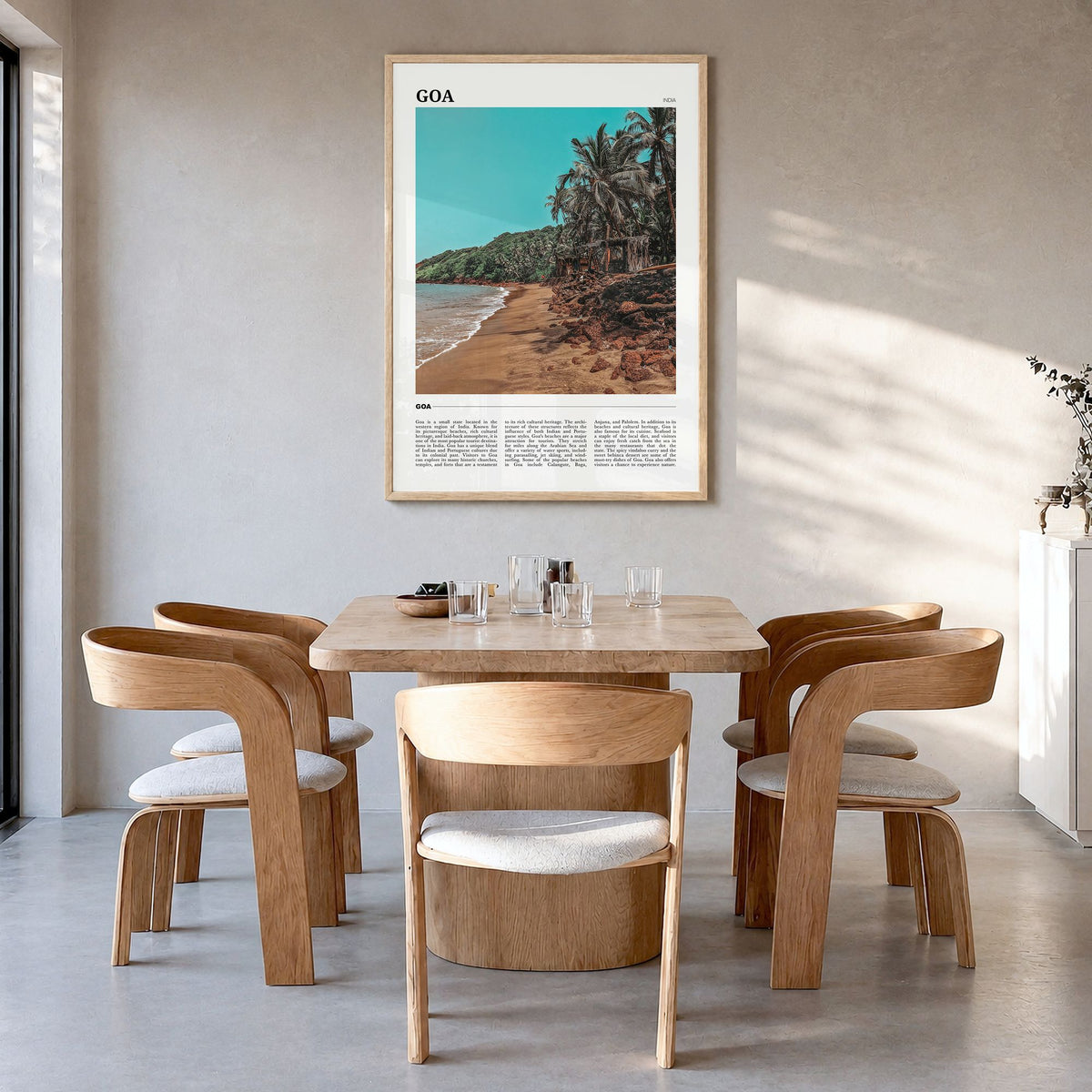 Goa Travel Poster in a natural wood frame, hanging in a dining room