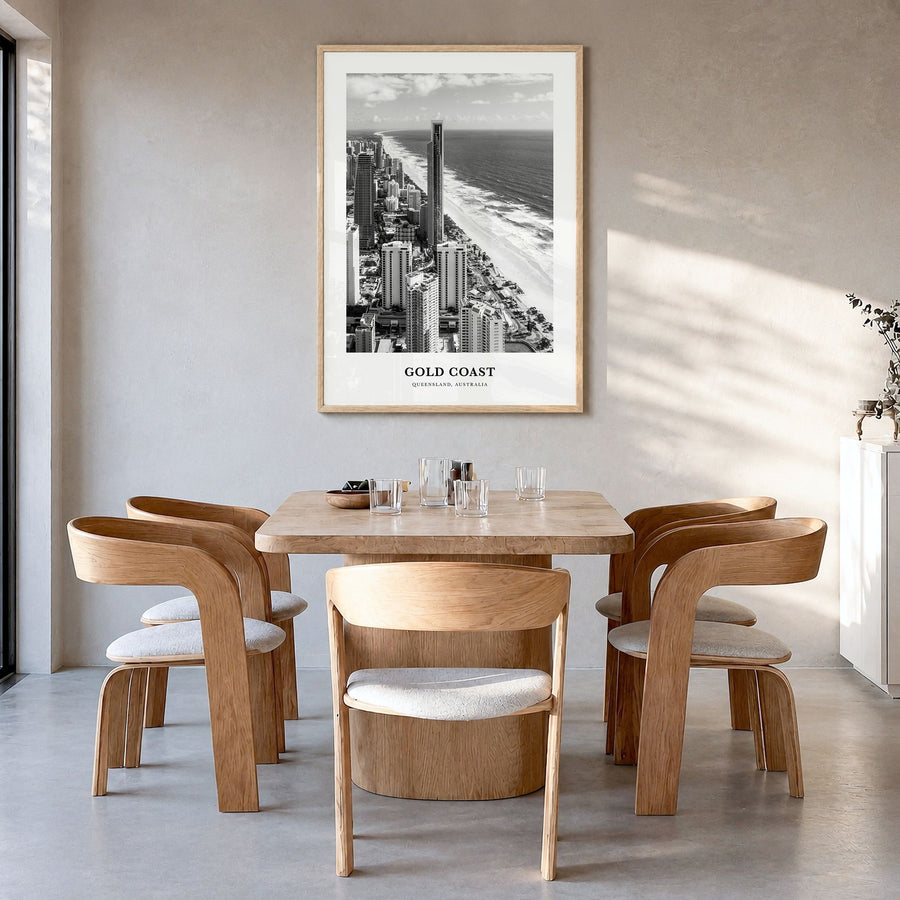 Gold Coast Classic Poster in a natural wood frame, hanging in a dining room