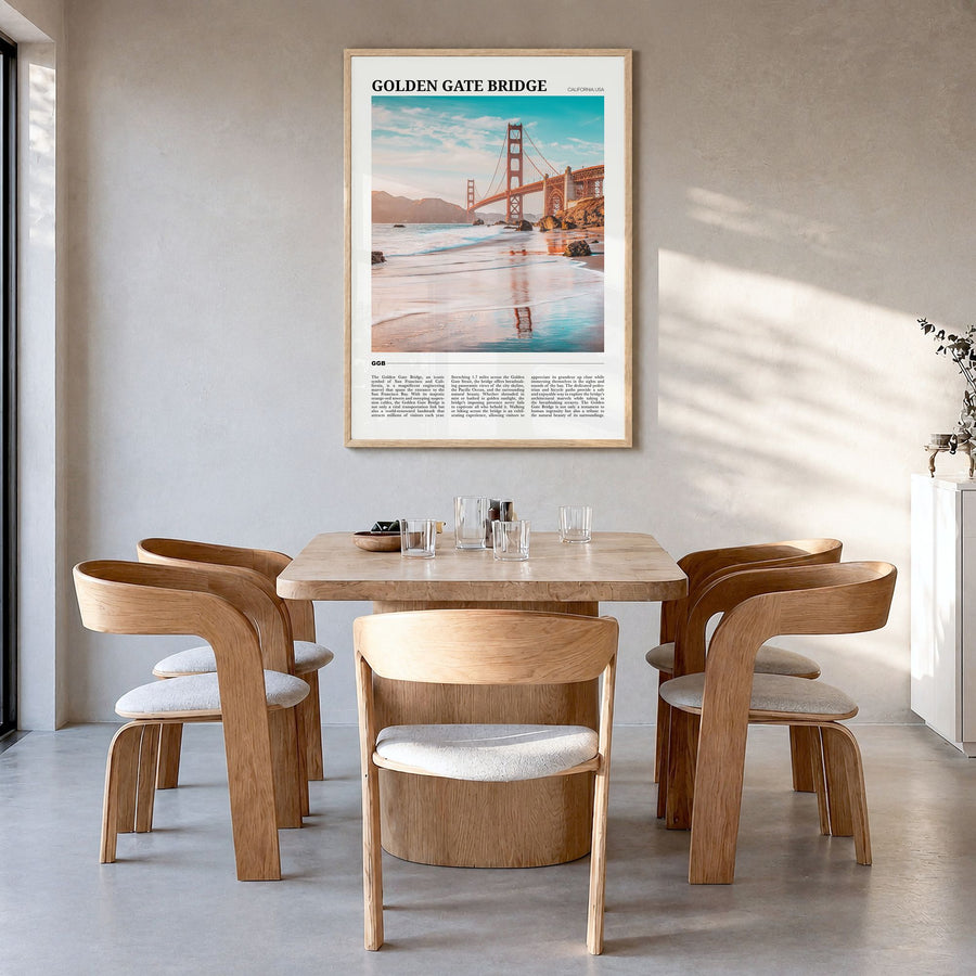 Golden Gate Bridge Travel Poster in a natural wood frame, hanging in a dining room
