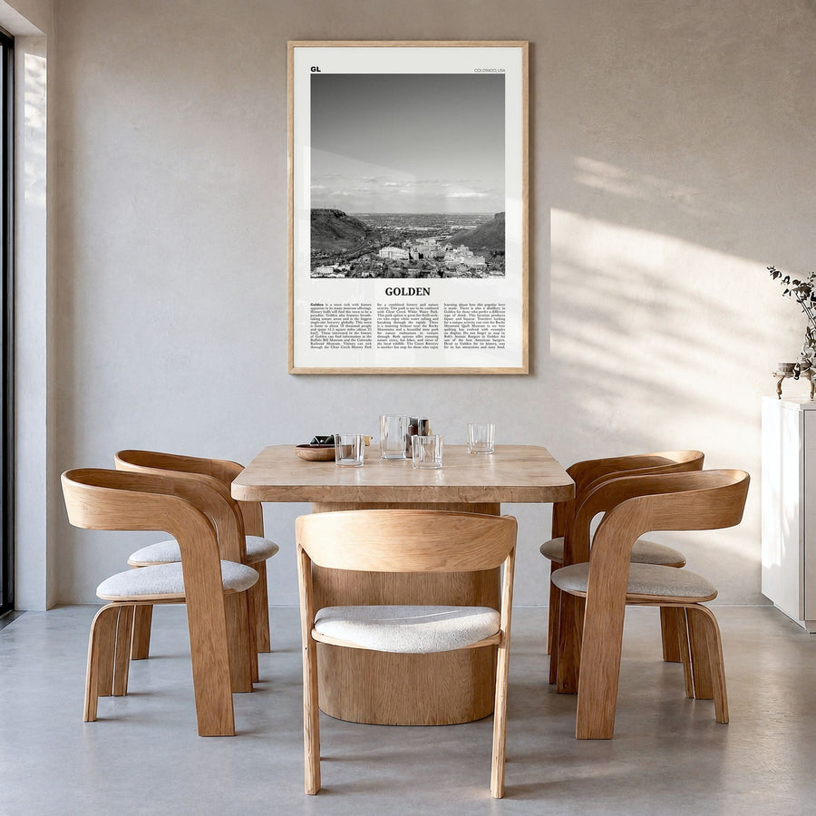 Golden Newspaper Poster in a natural wood frame, hanging in a dining room