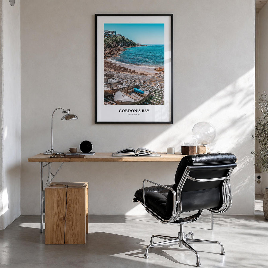 Gordon's Bay colorful classic poster of South Africa – vertical wall art in black wood frame, hanging on wall