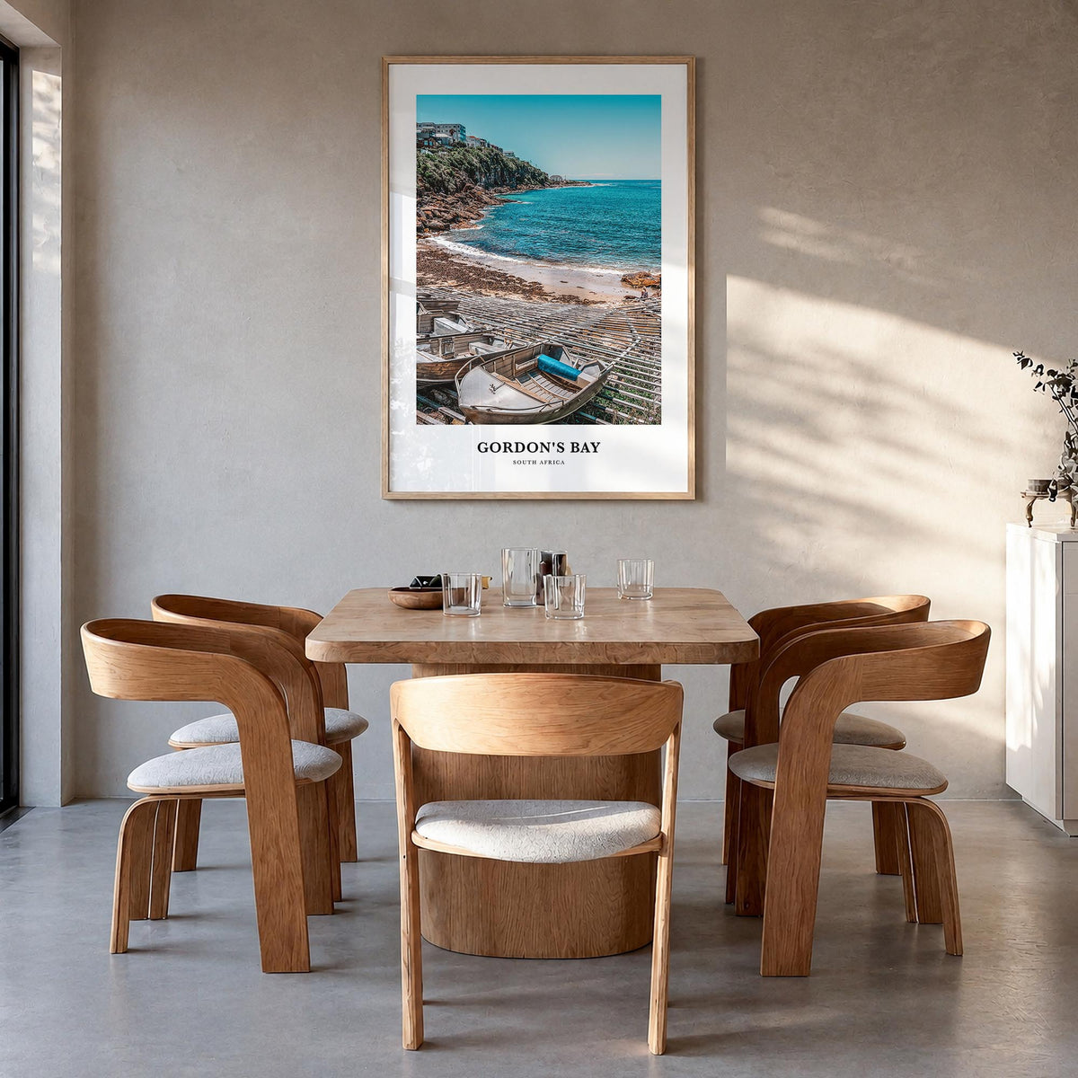 Gordon's Bay colorful classic poster of South Africa – vertical wall art in natural wood frame, hanging on wall